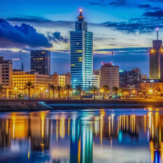 Casablanca City Skyline at sunset with modern towers and palm trees