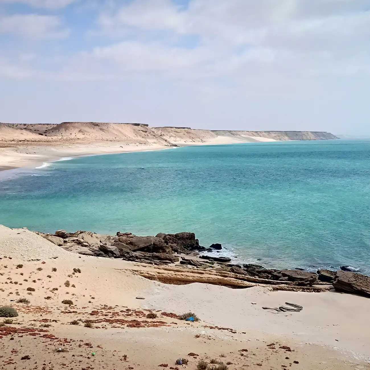 Porto Rico Beach in Dakhla City with crystal-clear turquoise water and white sand.