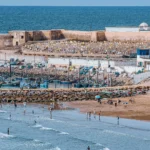 El Jadida City's beach with waves and golden sand